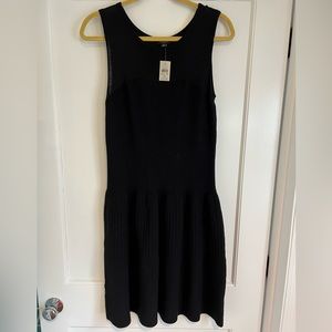 Ann Taylor. Black sweater dress with peplum bottom. Size Medium. NWT.
